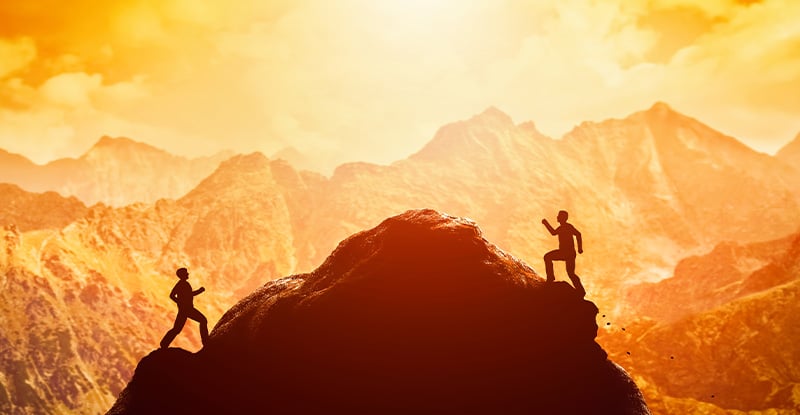 What is the redesigned learning format? When will the remaining core CPA preparatory courses be redesigned? An illustration that shows two men climbing a mountain from either side with one on the right closer to the top.