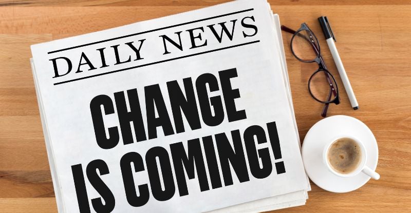 CPA PEP Update for the 2023/24 Academic Year A photo of a newspaper that reads "Daily news: Change is coming". There is a coffee mug and a pair of glasses on the right side of the table.