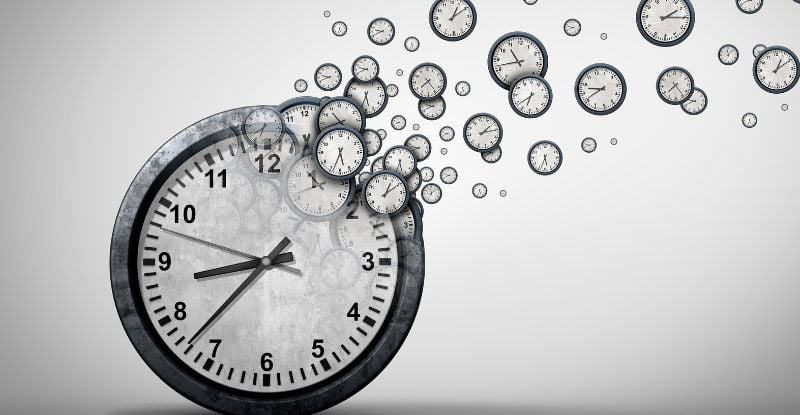 An illustration of a clock with more small clocks floating away from it to indicate the passage of time.