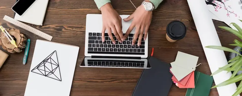 a person typing on a laptop
