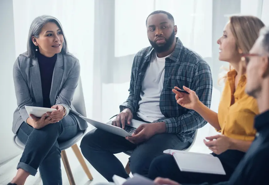 a group of people sitting in chairs