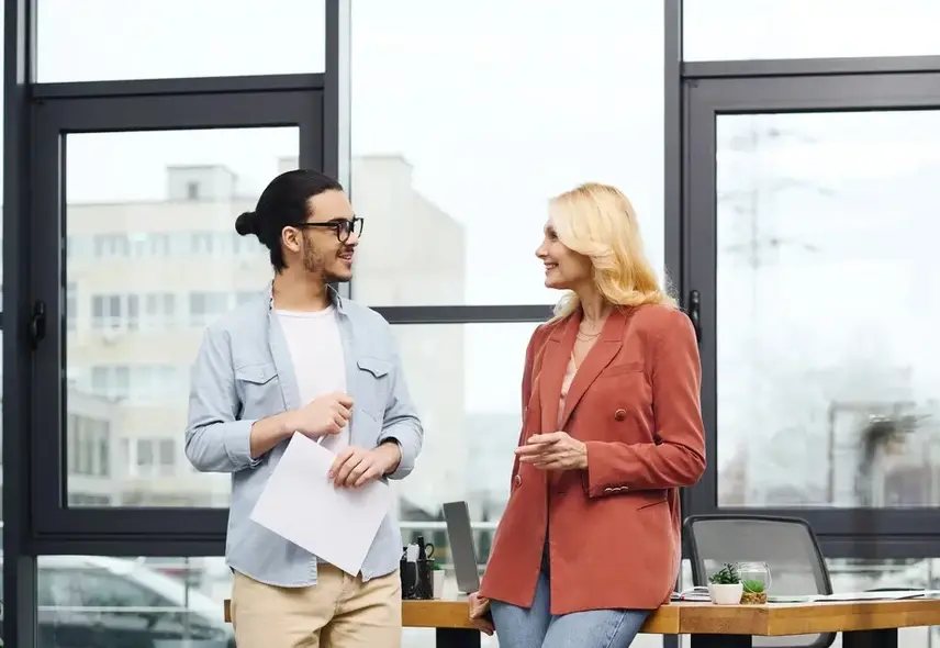a man and woman standing at a table