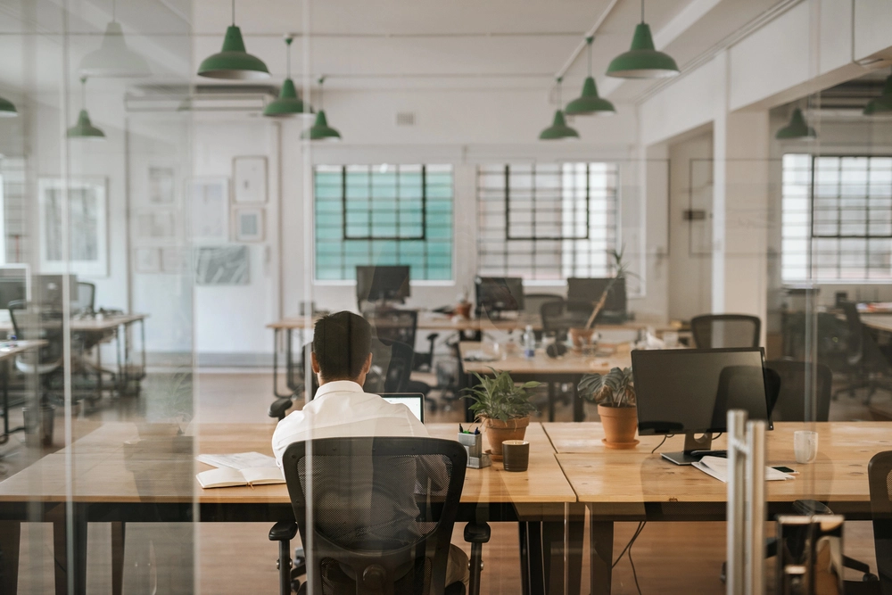 a man sitting at a desk in an office