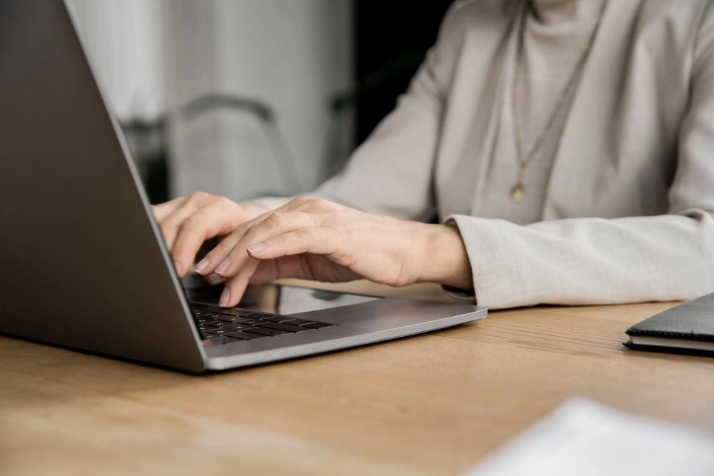a person typing on a laptop