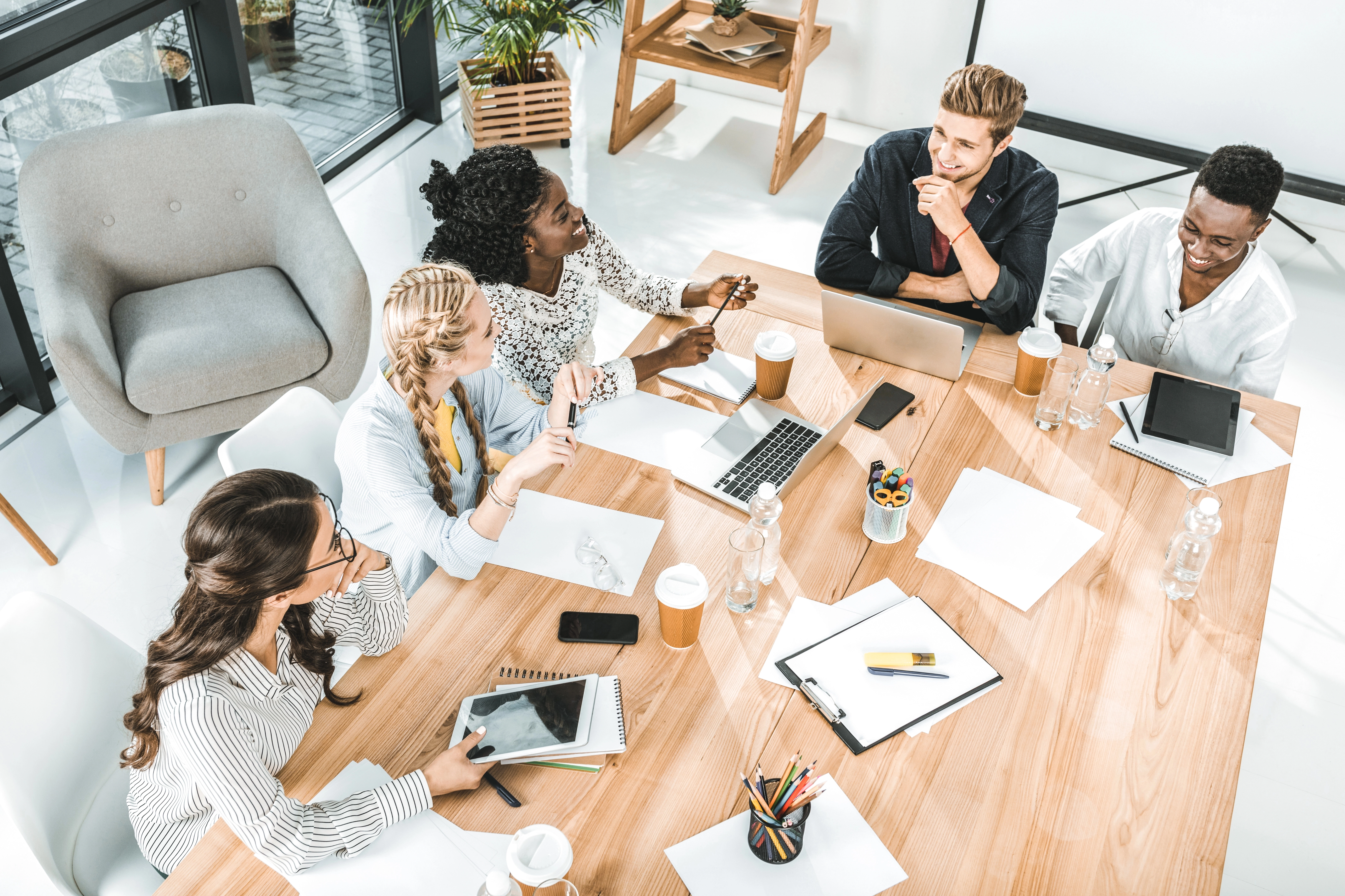 a group of people sitting around a table