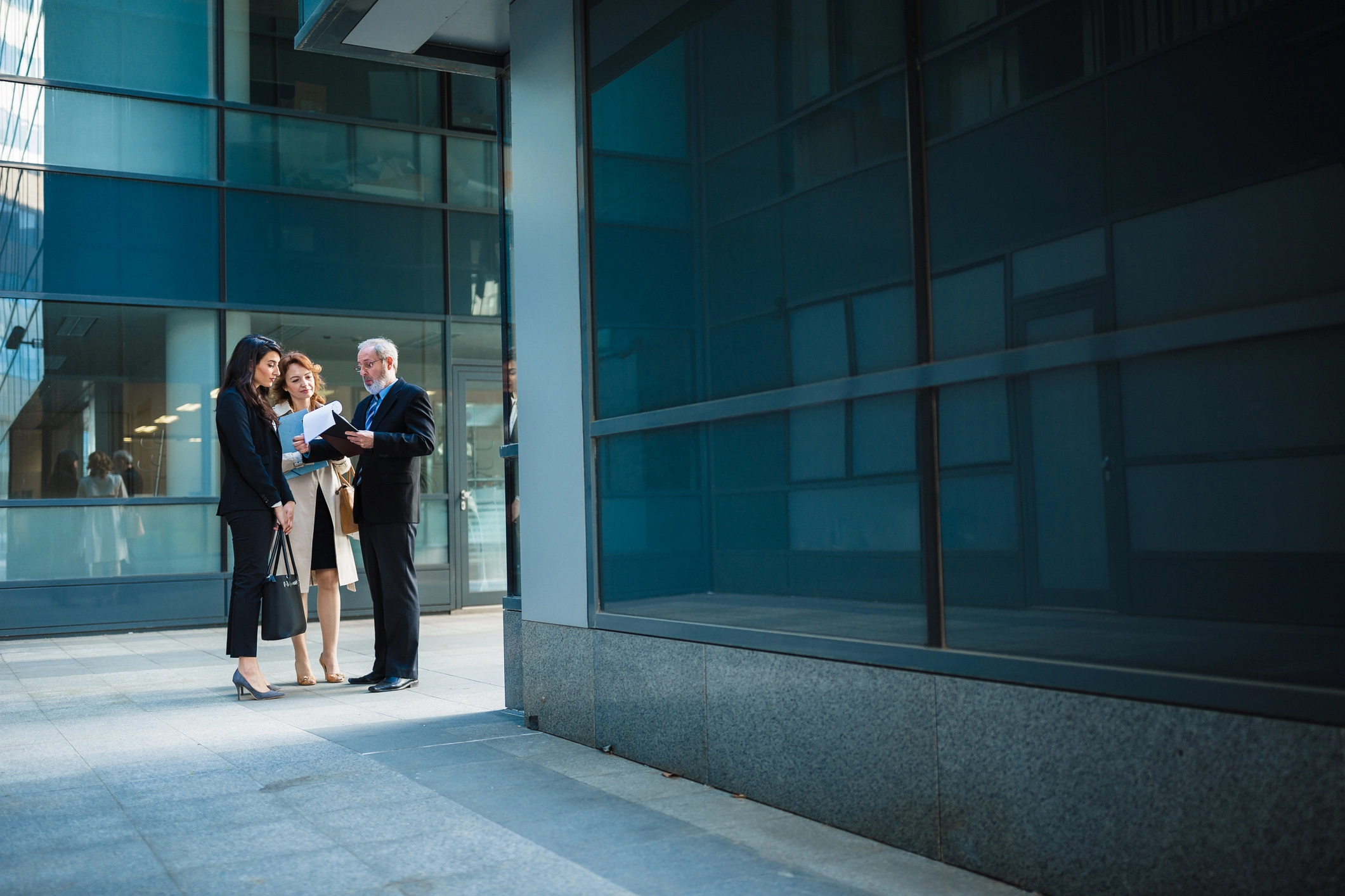a group of people standing outside a building