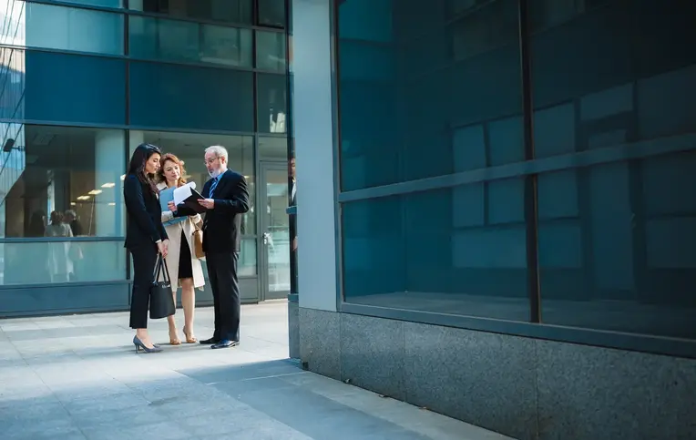 a group of people standing outside a building