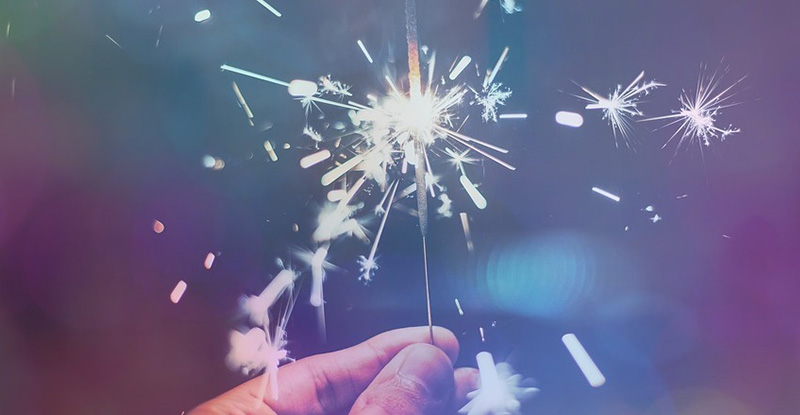 Meet Samantha Taylor, an Award-Winning CPAWSB Facilitator A photo of a person holding a sparkler creating a whimsical look.