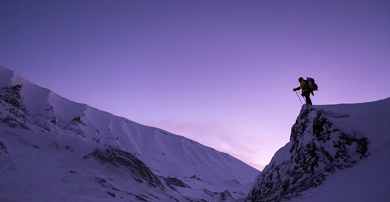 CPAWSB 2020/21 Update for CPA Preparatory Courses A photo of a person standing at the top of a snowy mountain.