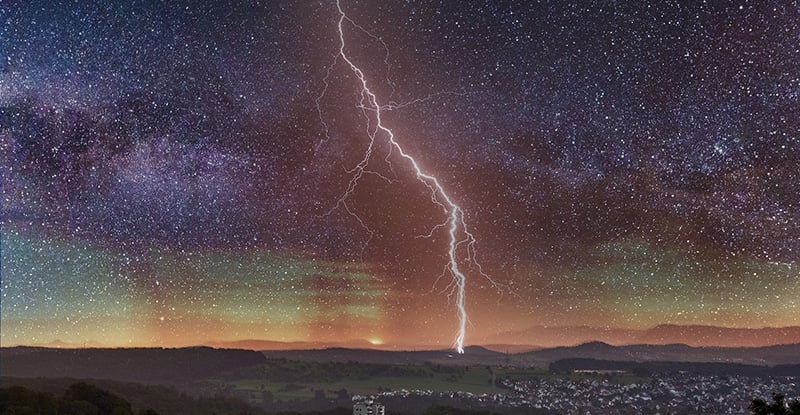 Power Move: Part 1 – The Candidate A photo of a lightening striking in the distance on a clear starry night.