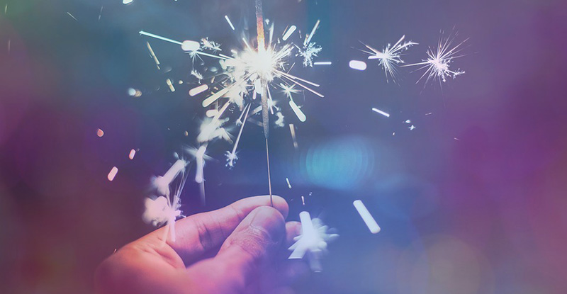 Award Winners 2020/2021 A photo of a person holding a sparkler creating a whimsical look.