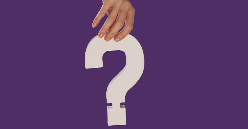 An illustration of a person holding a question mark on a purple background.