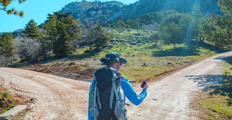 The Subtle Art of Sarcasm: Why candidate professionalism at virtual workshops is ‘overrated’ A photo of a man hiking with a digital compass is standing at a crossroads, trying to figure out which way to go.
