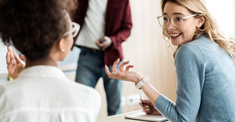 Choosing your CPA PEP Electives – Part 1: TXN, ASU, FIN, and PM…oh my! A photo of students discussing and laughing at something.