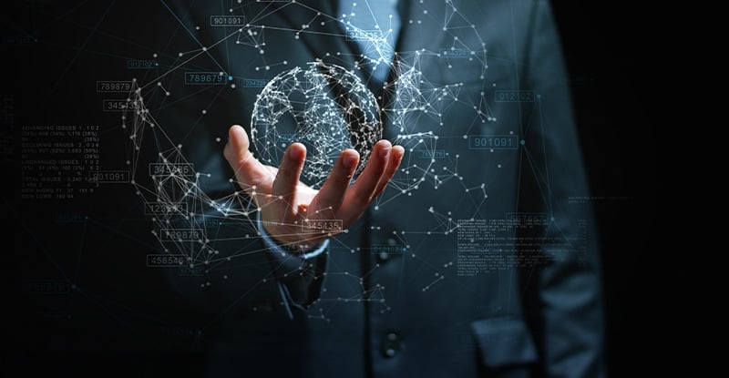 Introducing the new Competency Map A man in a suit holding a globe made up of interconnected lines, symbolizing a network. The lines form the shape of a globe, representing global connectivity.
