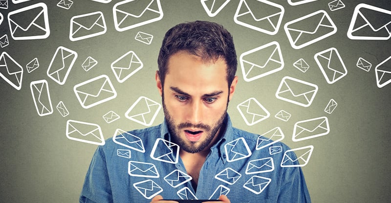 Gettin’ (and Stayin’) PEP-py: Registration Dates and Deadlines A photo of a man looking surprised while holding a phone in his hand. Message icons are flying out of the phone, symbolizing him receiving numerous messages.