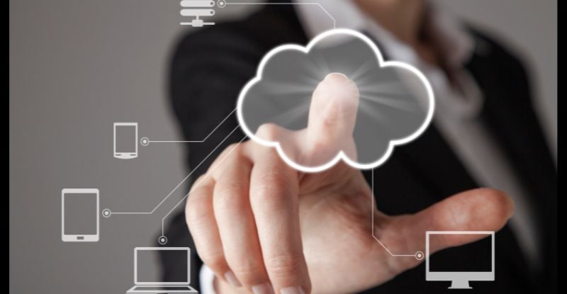 When and how can I access the Statement of Completion for the CPA preparatory courses? A photo of a man pointing straight toward the camera, with a cloud illustration connecting to a phone and laptops through straight lines, symbolizing accessibility at one's fingertips.
