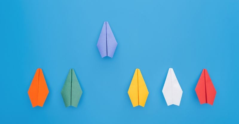 CPA PEP: Here for that An illustration against a blue background featuring six paper airplanes, with one airplane positioned ahead to represent progress and getting ahead in life.