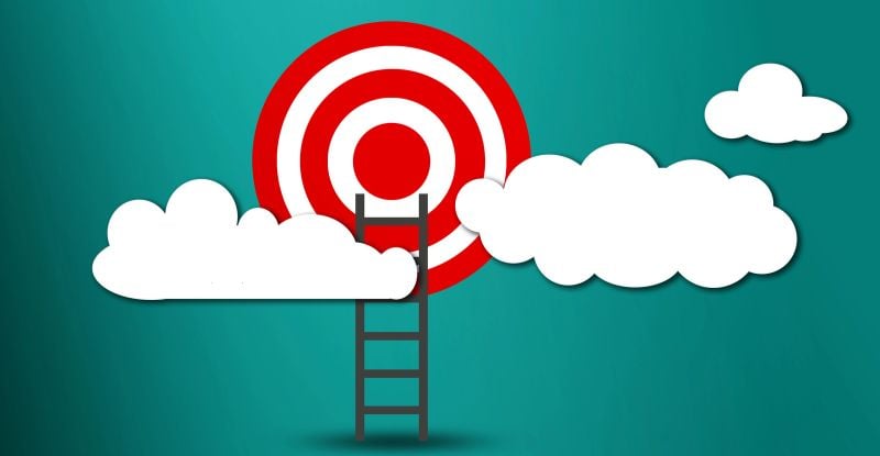 Movit…Motiv…MotiVACATION An illustration of a target circle hovering above the clouds, with a ladder extending upward toward the target, symbolizing the journey of reaching one’s goals.